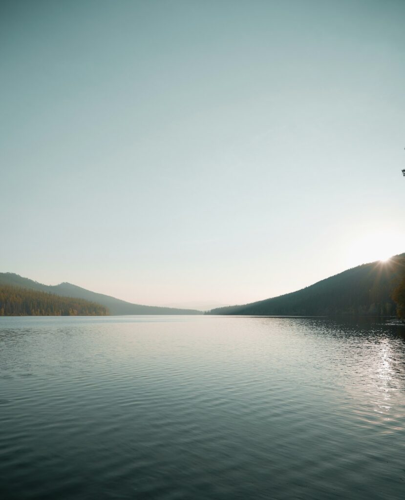 A lake near mountains, representative image