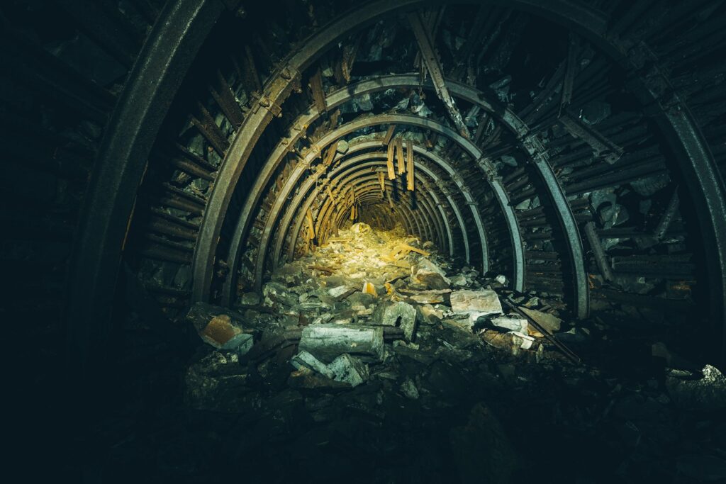 Mine tunnel with rubble, representative image