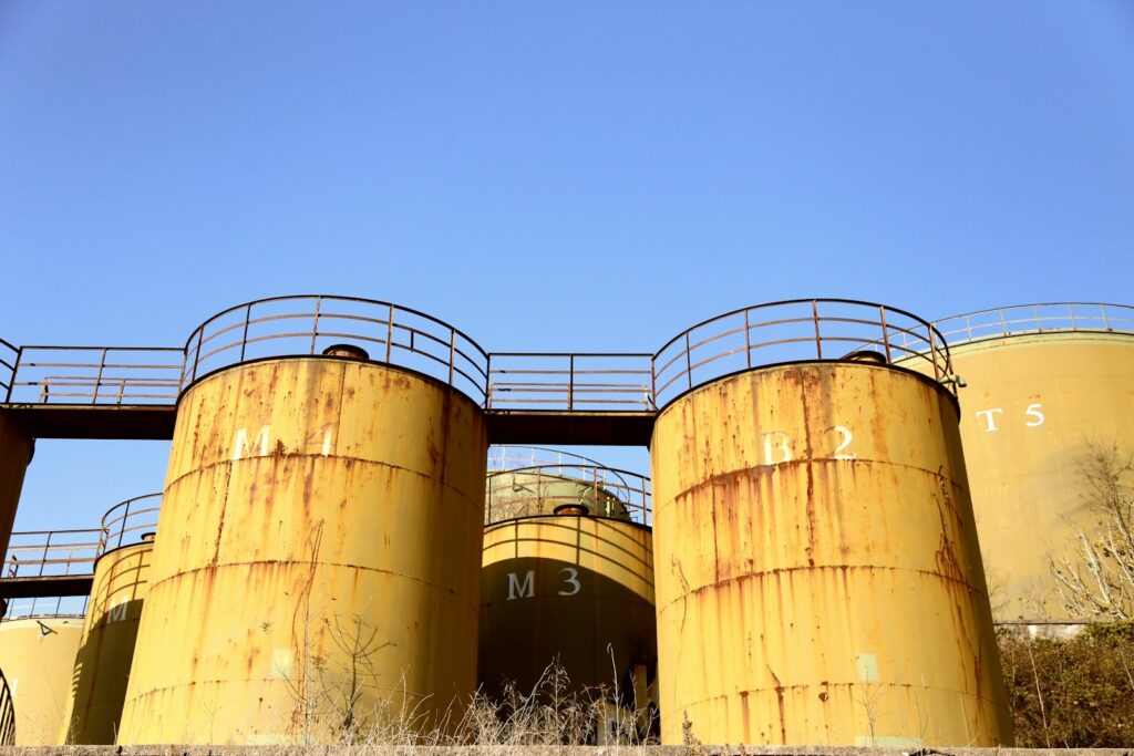 Steel storage tank under sky, representative image