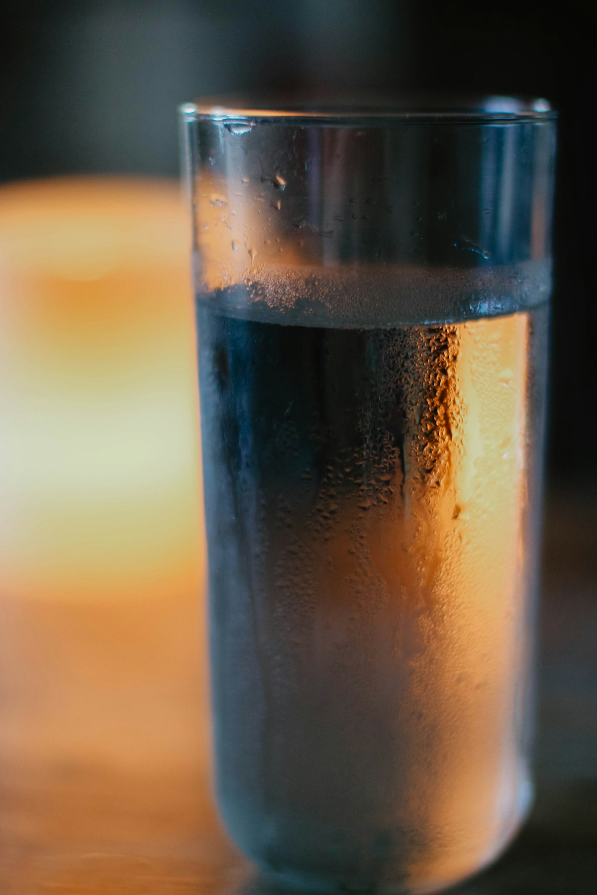Glass of water on a wooden table