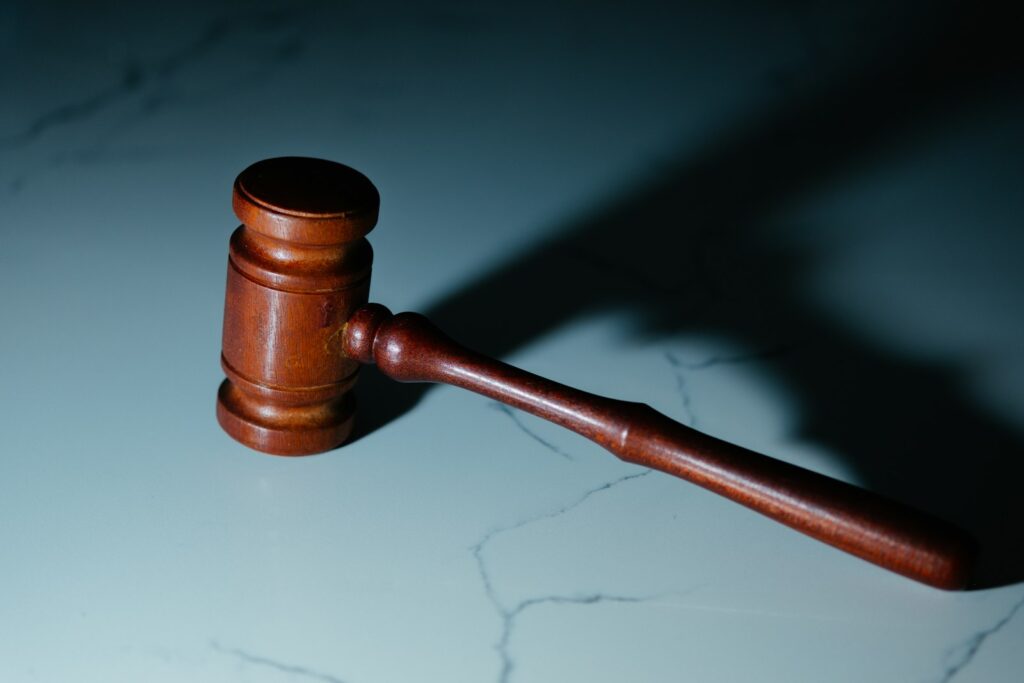 Wooden judges gavel on a table, representative image