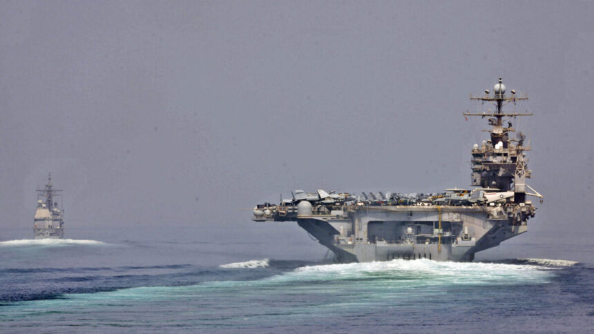 US Navy ships transit the Strait of Hormuz
