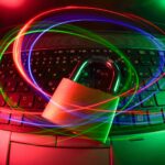 Cybersecurity concept image of a padlock on a laptop with light trails