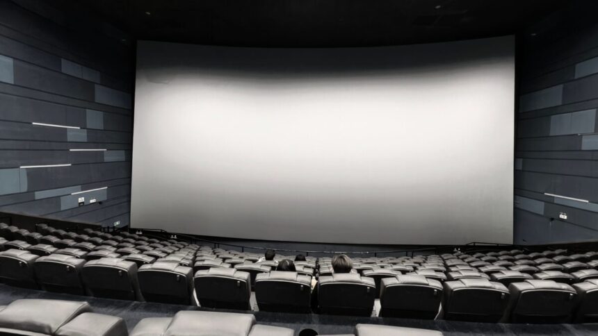 Empty cinema movie theater auditorium with screen