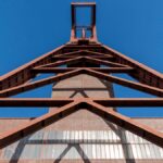 Steel industrial structure against sky, illustrative image