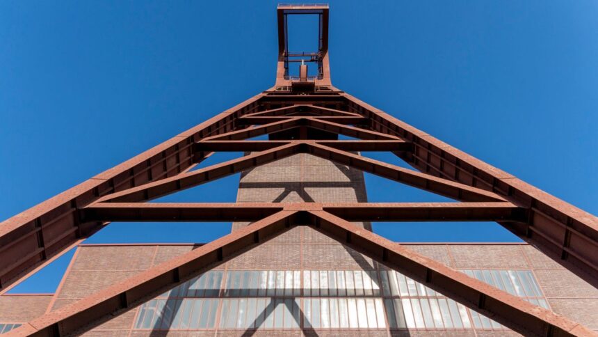 Steel industrial structure against sky, illustrative image