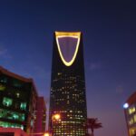 Riyadh skyline at twilight showing the illuminated Kingdom Centre tower, Saudi Arabia