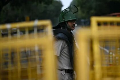 Delhi Police personnel stand guard ahead of the Cockroach Janata Party protest in New Delhi
