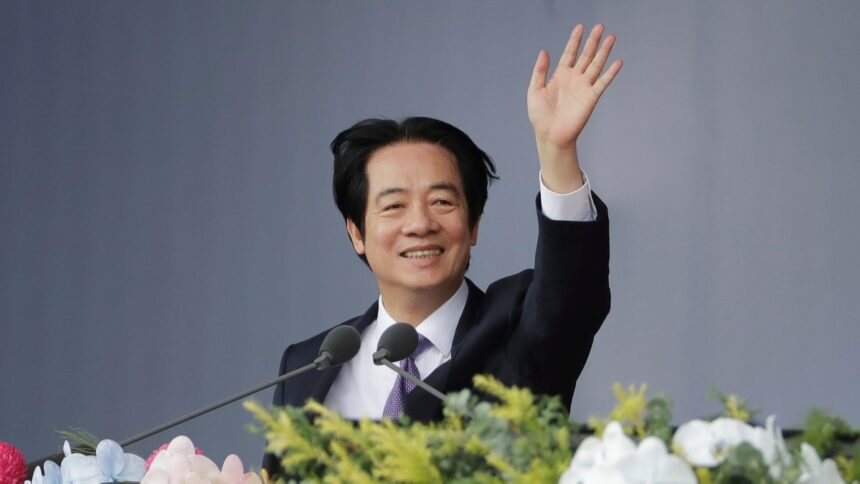 Taiwanese President Lai Ching-te waves during National Day celebrations in Taipei