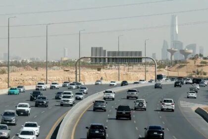 Traffic on a road with the Riyadh skyline behind, file photo