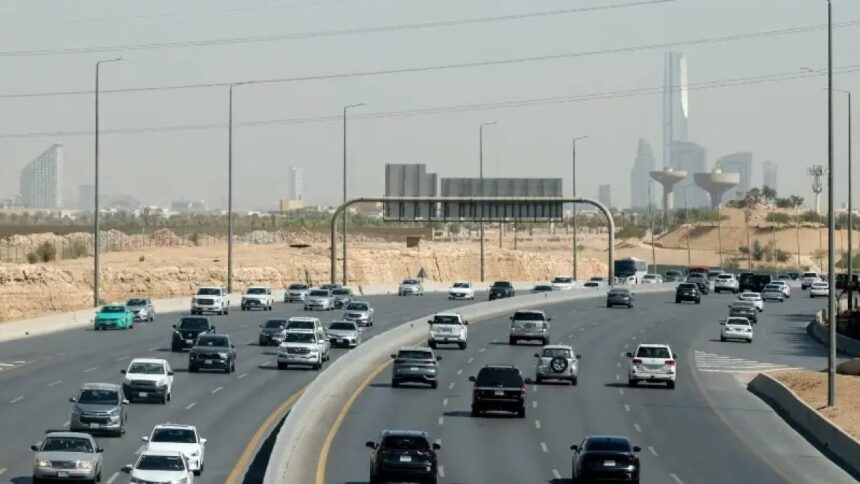 Traffic on a road with the Riyadh skyline behind, file photo