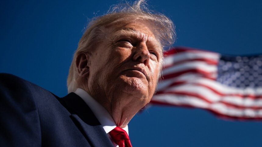 President Donald Trump speaks with reporters on the White House South Lawn before boarding Marine One